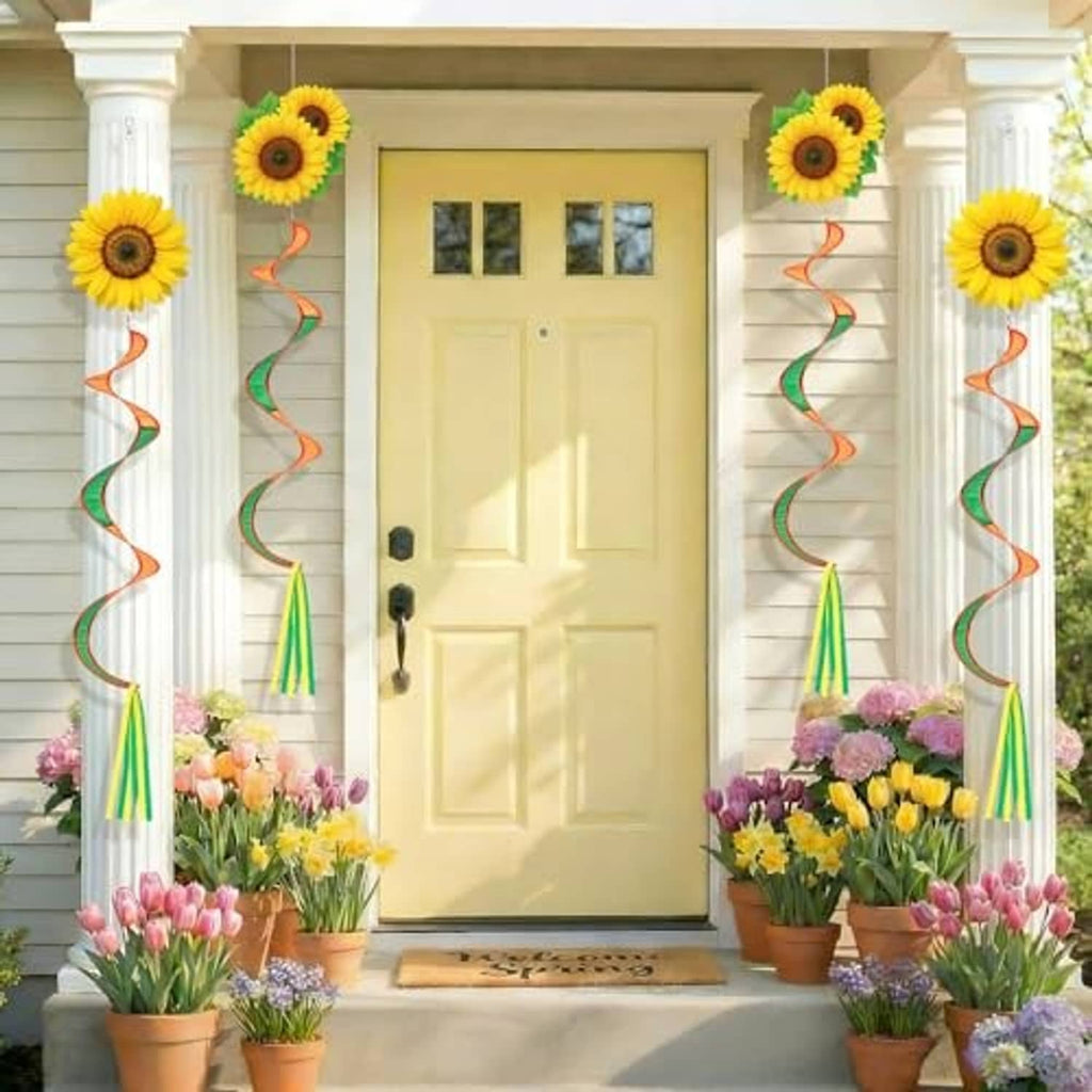 Sunflower windsock hanging decor on porch columns with orange-green ribbon spirals