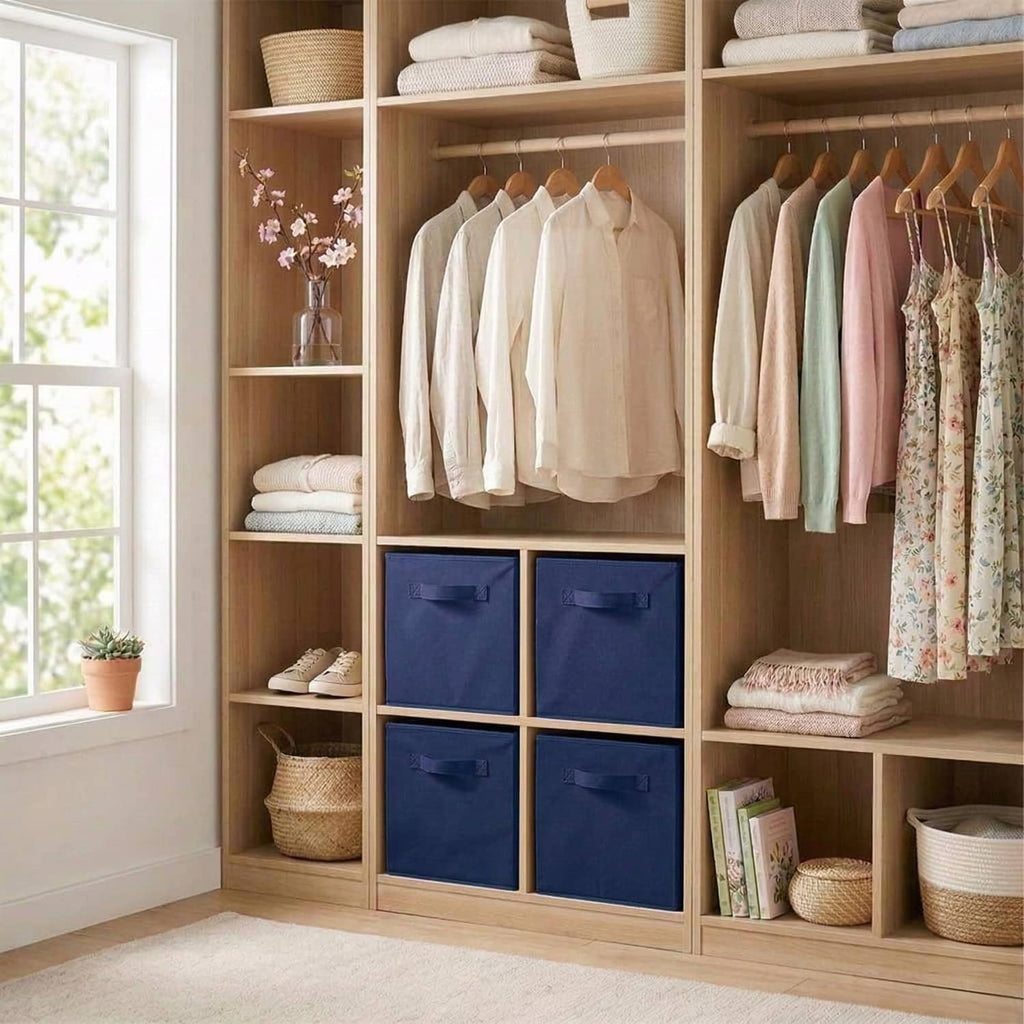Dark blue fabric storage cubes in a closet, stacked in cubby compartments