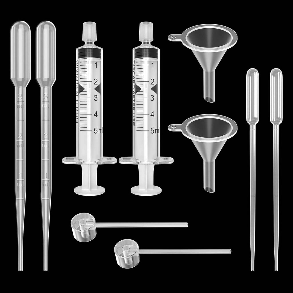 Plastic perfume refill tool kit with measuring syringes, funnels, and transfer tube