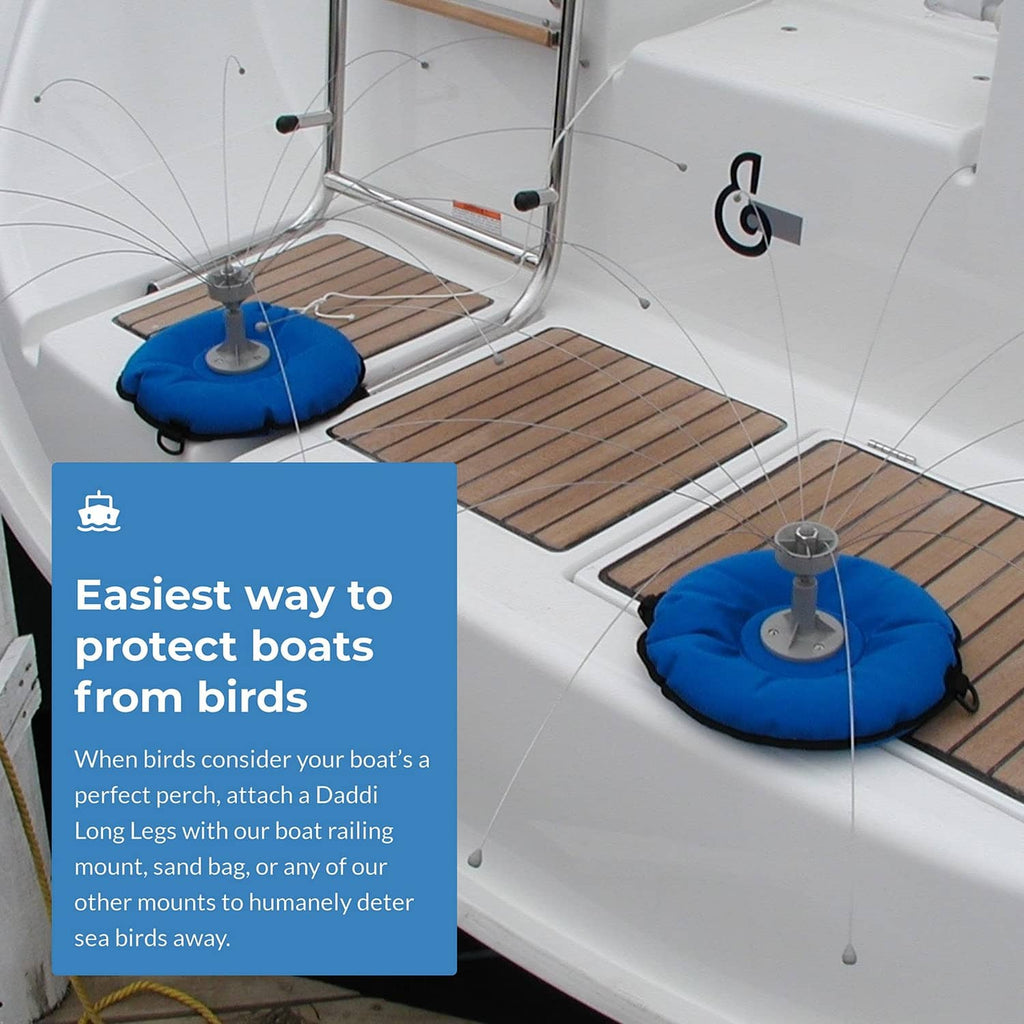 Bird deterrent spider with long wire legs on a boat deck near a mounting post
