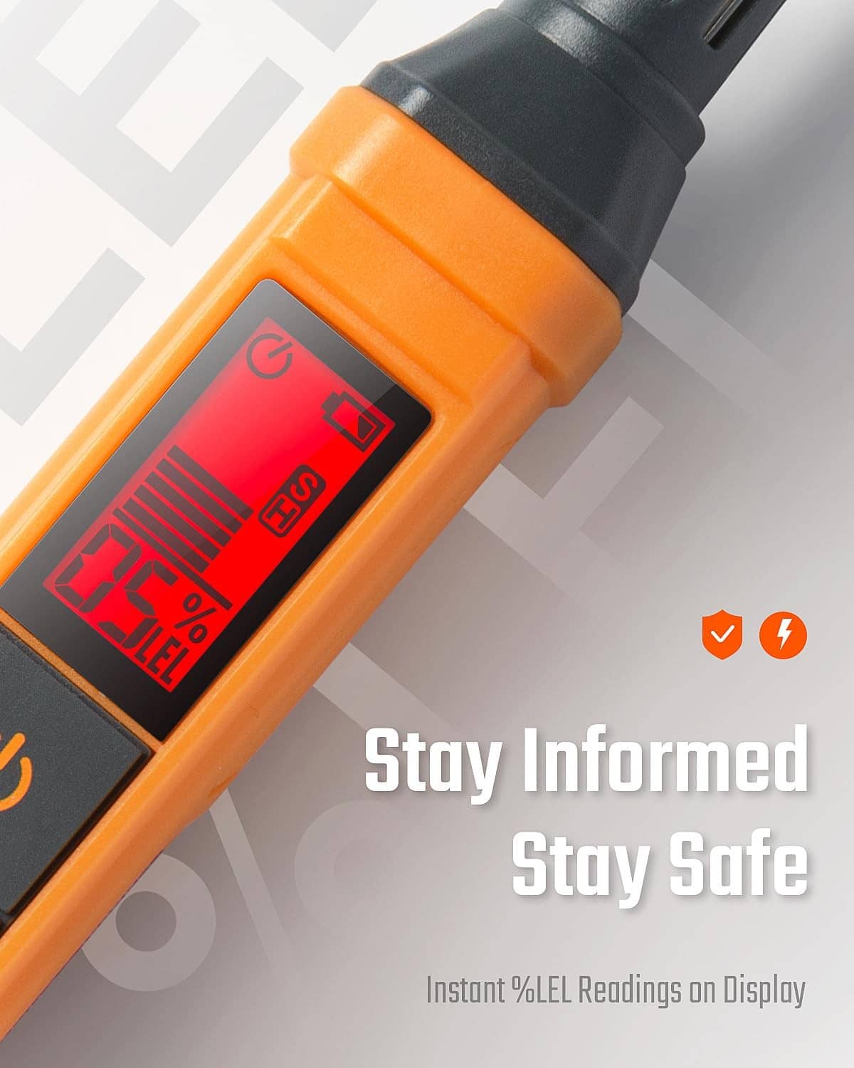 Orange handheld gas detector with green LCD screen and black grip end.