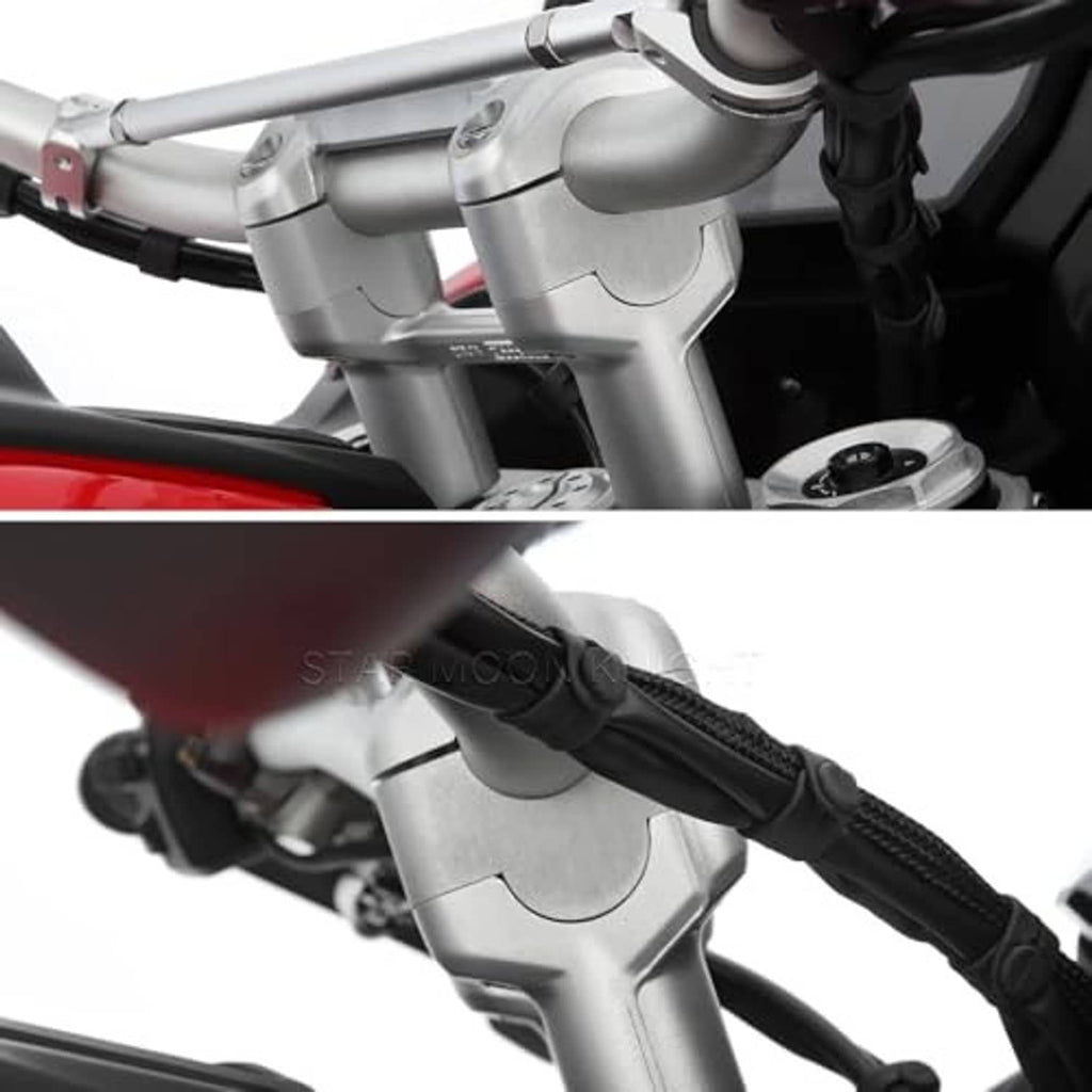 Mounted silver handlebar riser clamp with handlebars and black grip
