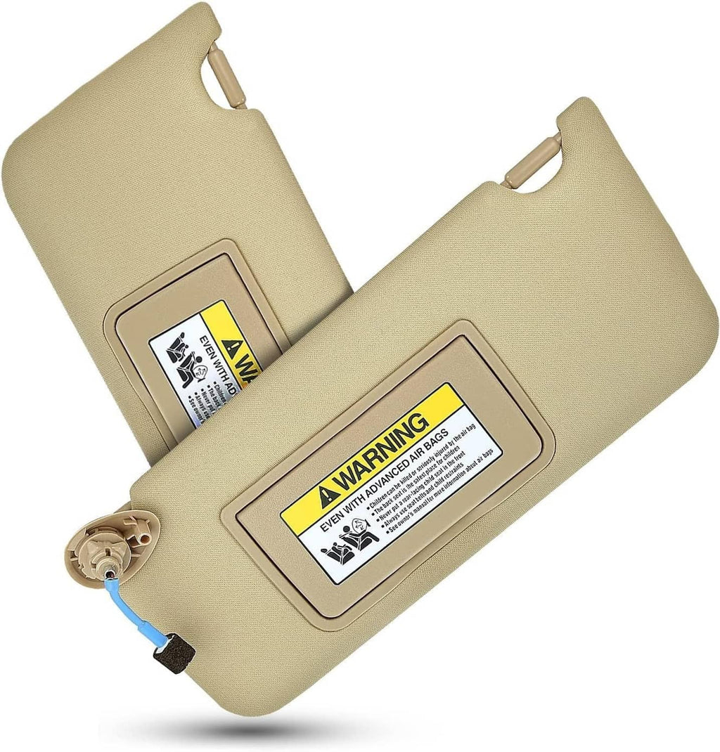 Set of tan sun visors with vanity mirror lights, warning labels visible on inner panel