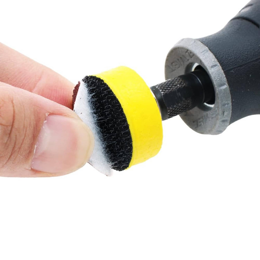 1-inch abrasive sanding disc on a yellow backing pad with black tool mandrel