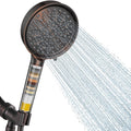 Oil-rubbed bronze filtered shower head with handheld sprayer and spray stream
