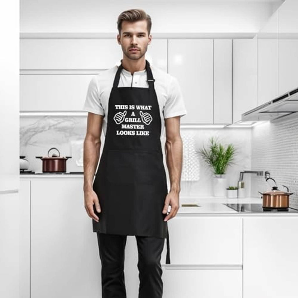 Black grilling apron worn by a man in a kitchen, with front pocket