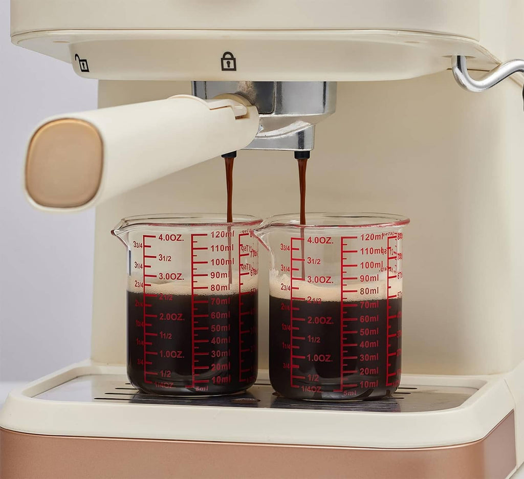 Clear glass measuring cups with red scales, upright and nested for storage.
