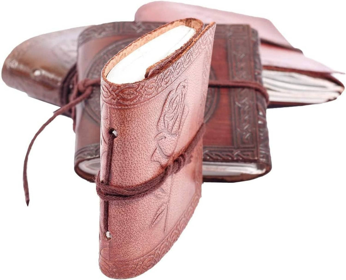 Embossed leather mini pocket notebook with rose motif and dark tie strap, side view
