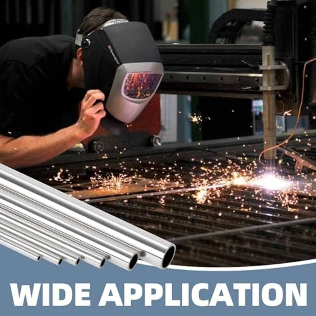Stainless steel round tube on cutting table with visible sparks