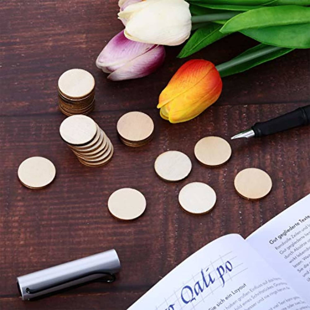 Unfinished round wood craft discs scattered, natural brown edges with light, unpainted faces