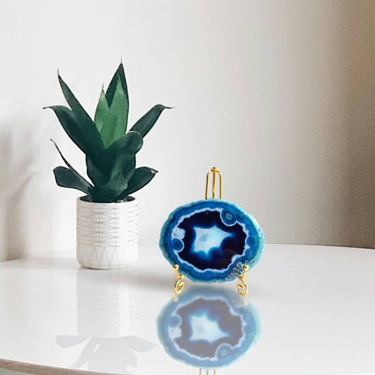 Blue agate geode coaster ornament displayed with decorative stand hardware