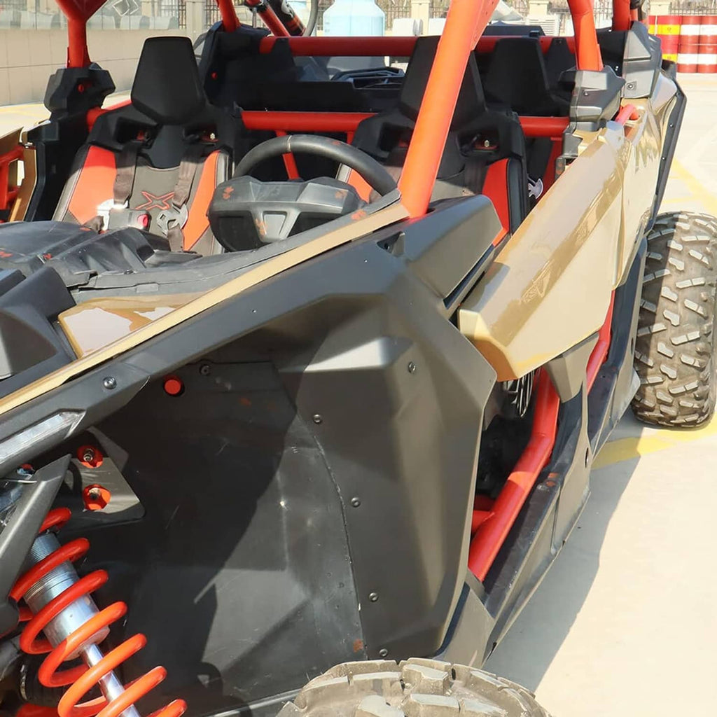 Installed black fender flare along UTV side panel near the front wheel
