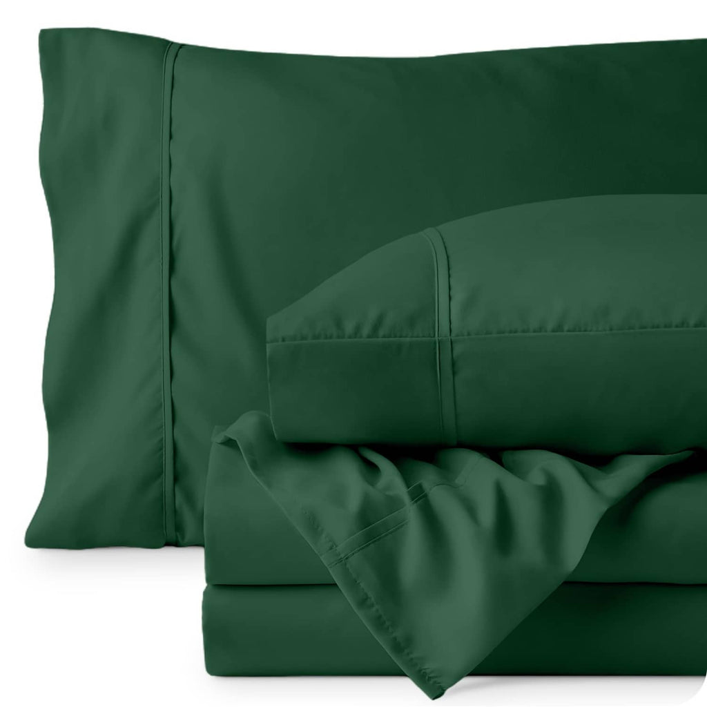 Forest green pillowcase and sheet set close-up, stitched seams and edges
