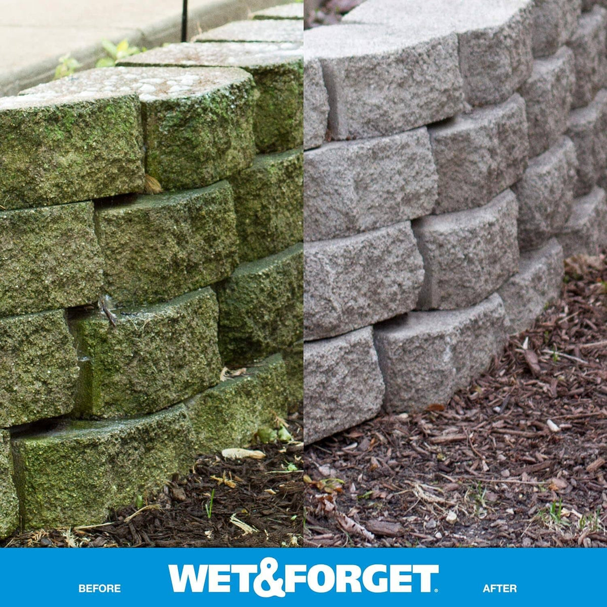 Mossy stone retaining wall blocks with green algae stains on outdoor surface