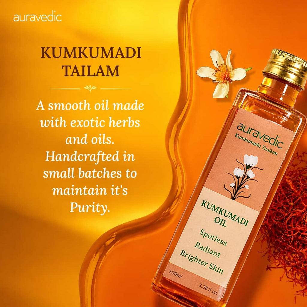 Kumkumadi oil bottle with gold cap beside flower and herb accents, front label visible.