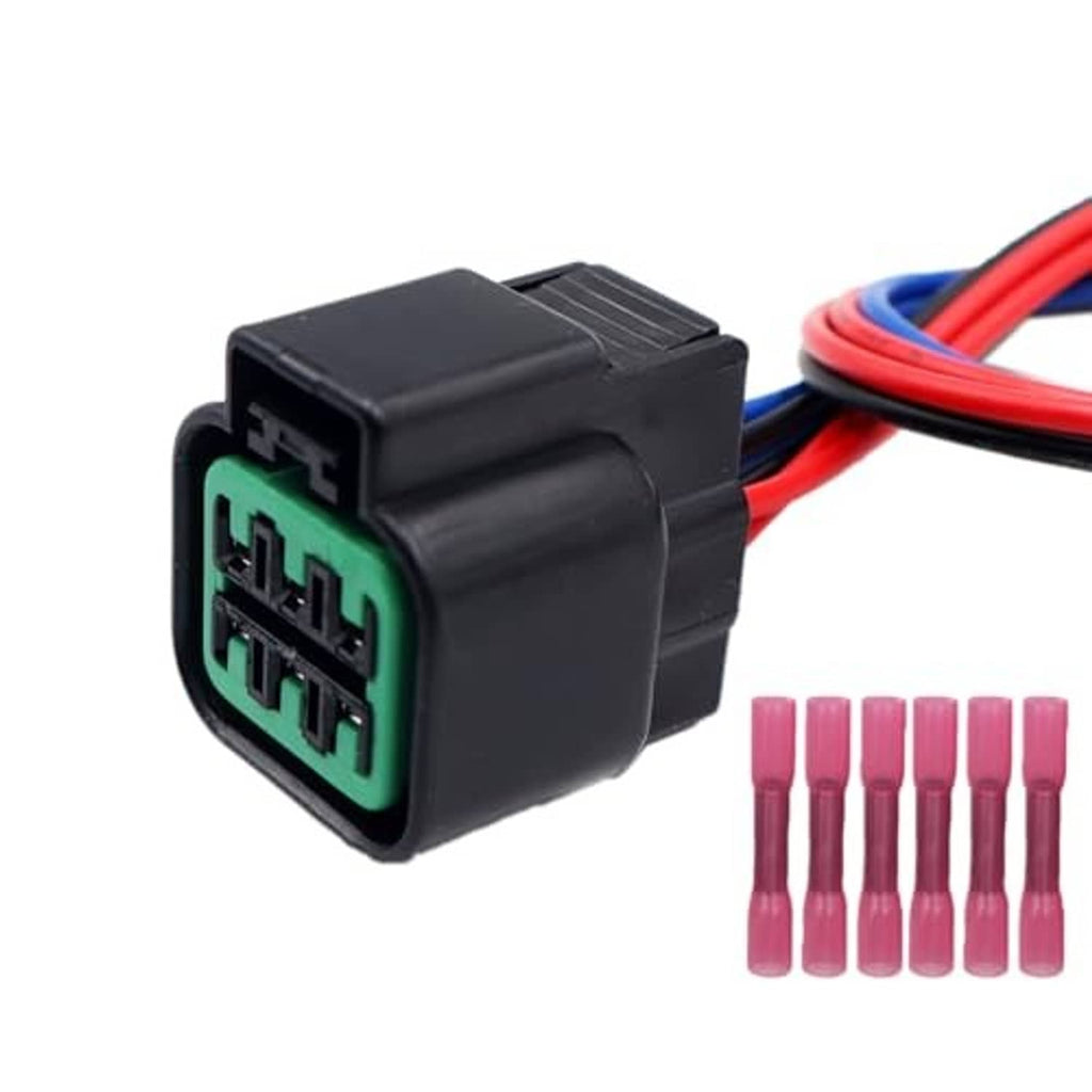 6-pin headlight connector with green terminal block, red/blue leads, and pink caps
