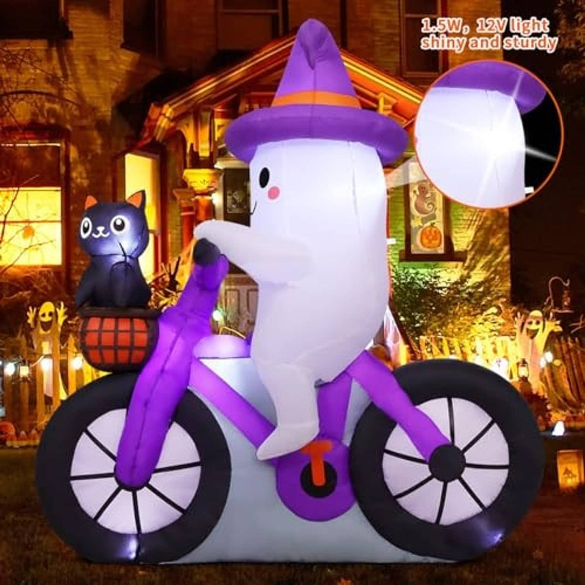 Lit inflatable ghost on black bicycle with purple accents and cat holding pumpkin basket