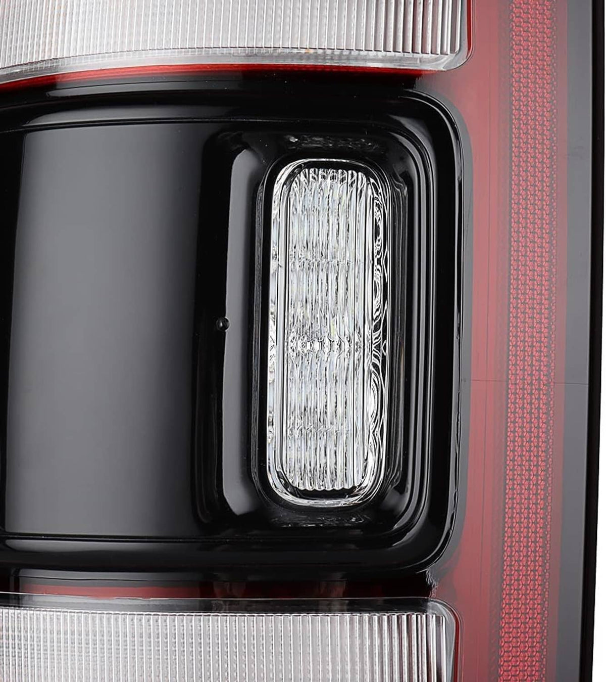 Black-bezel LED tail light lamp with clear lens insert and red trim border.