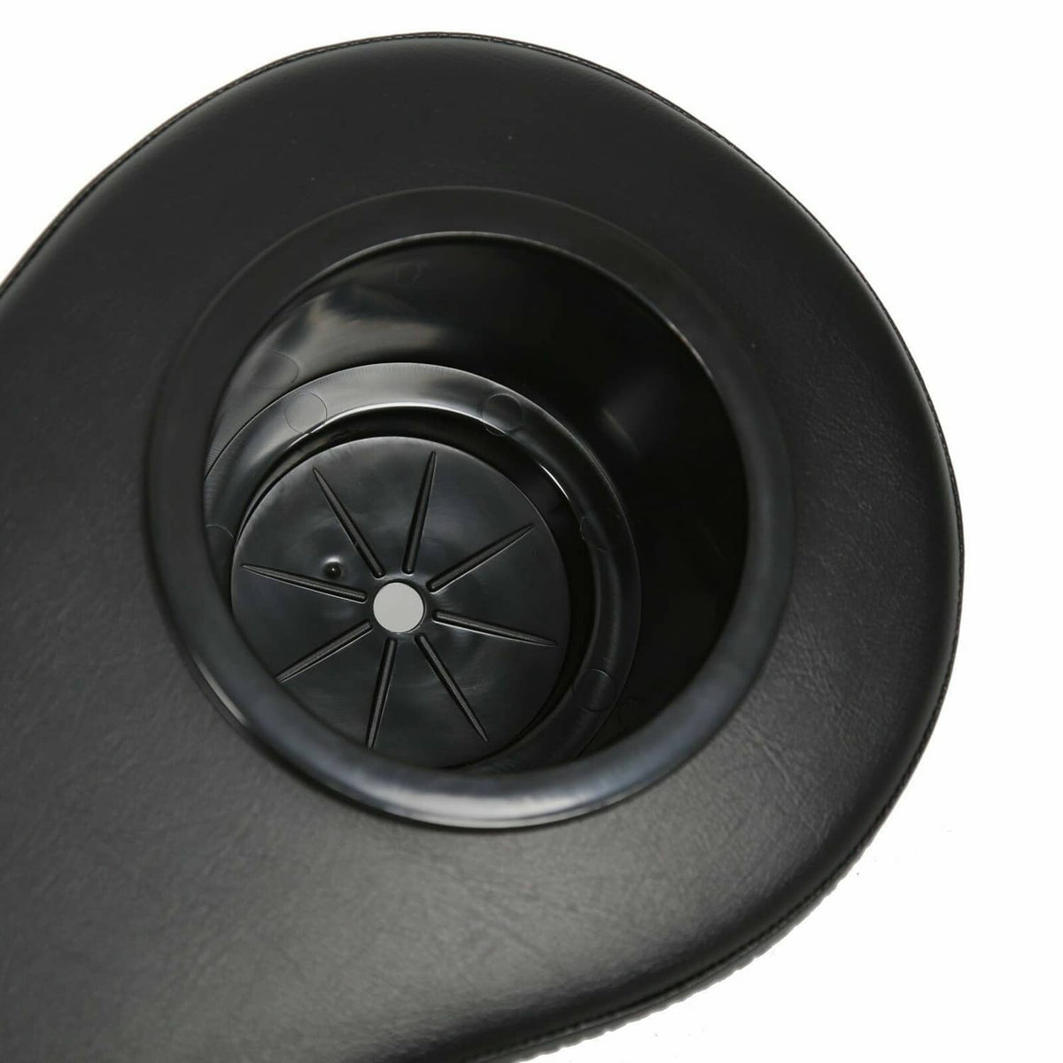 Black round cup holder insert with ridged wheel detail on golf cart arm rest