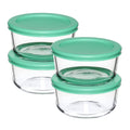 Stacked round glass storage containers with teal lids