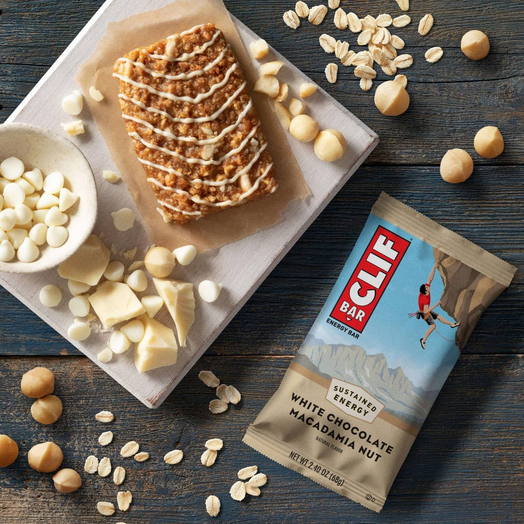 CLIF Bar white chocolate macadamia energy bar pack with scattered white chocolate pieces