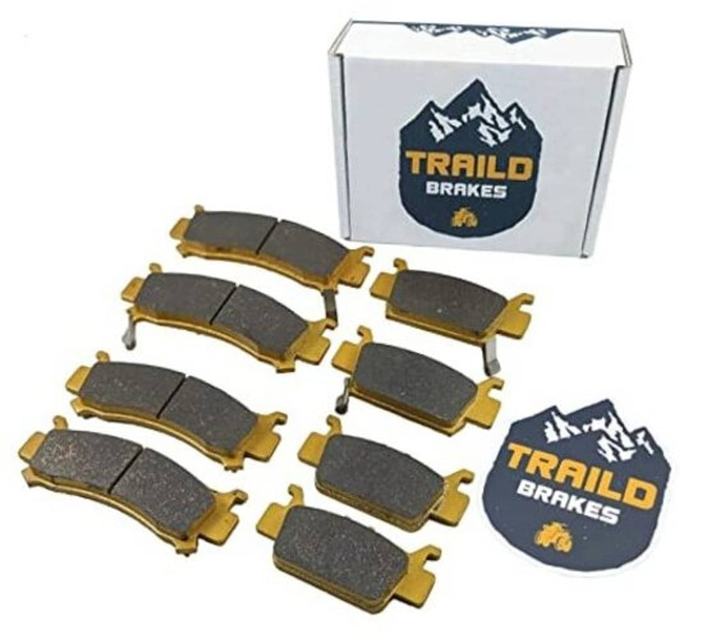 Ceramic brake pad set with multiple dark gray pads and gold mounting hardware, in box