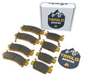 Ceramic brake pad set with multiple dark gray pads and gold mounting hardware, in box