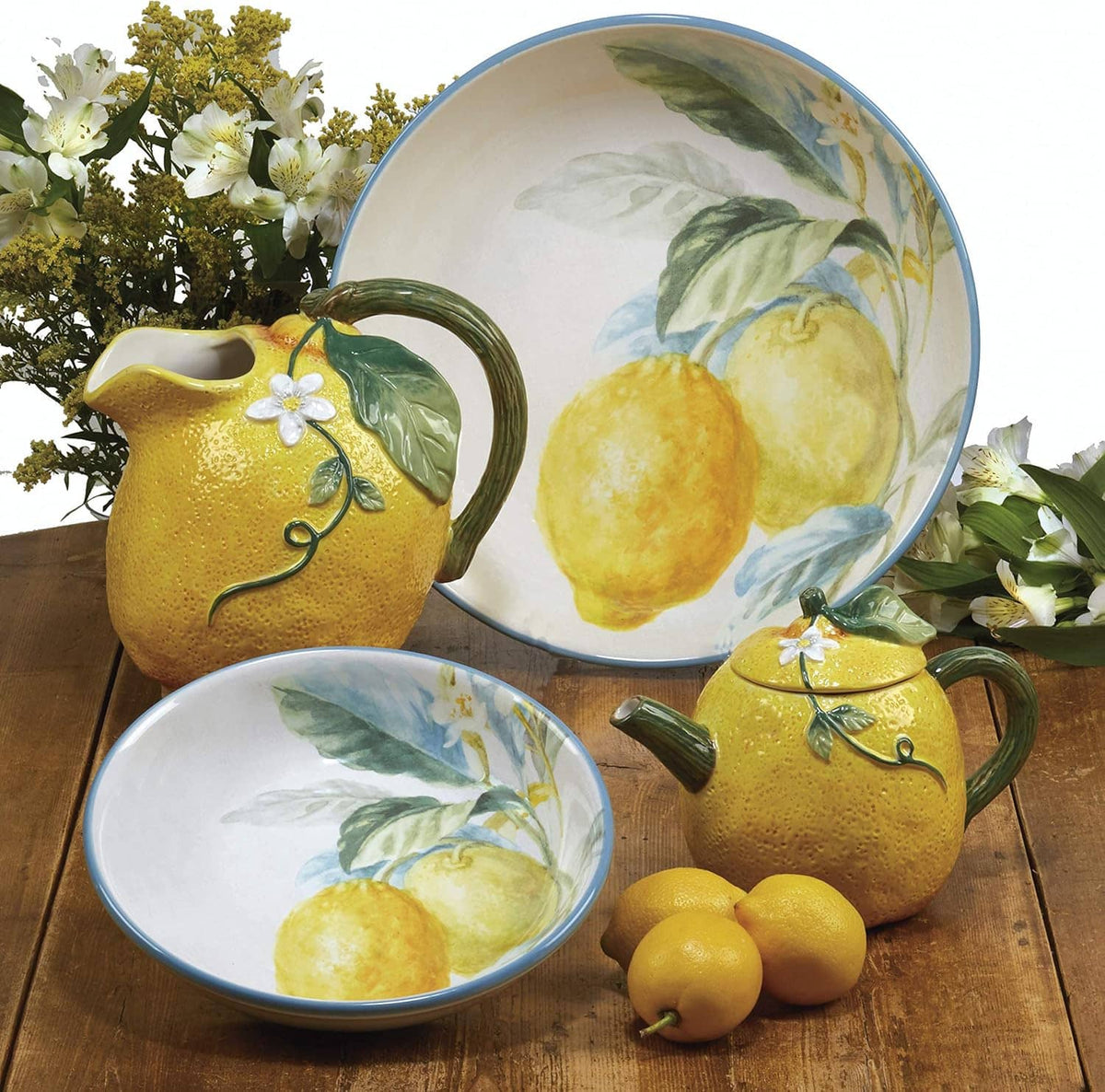 Ceramic lemon serving bowl and pitcher with yellow fruit design and green leaves