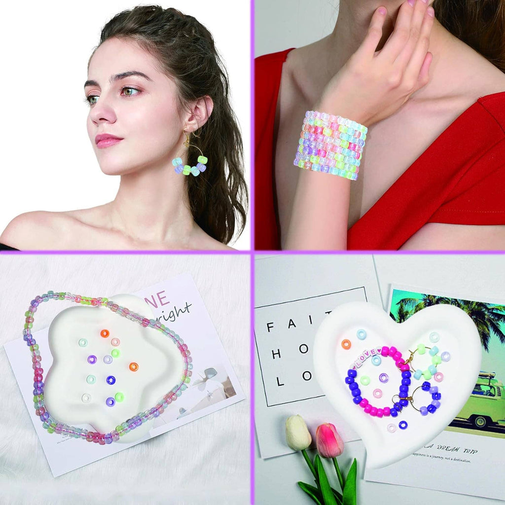 Finished pony bead bracelets and letter bead designs on a model and on a heart-shaped board