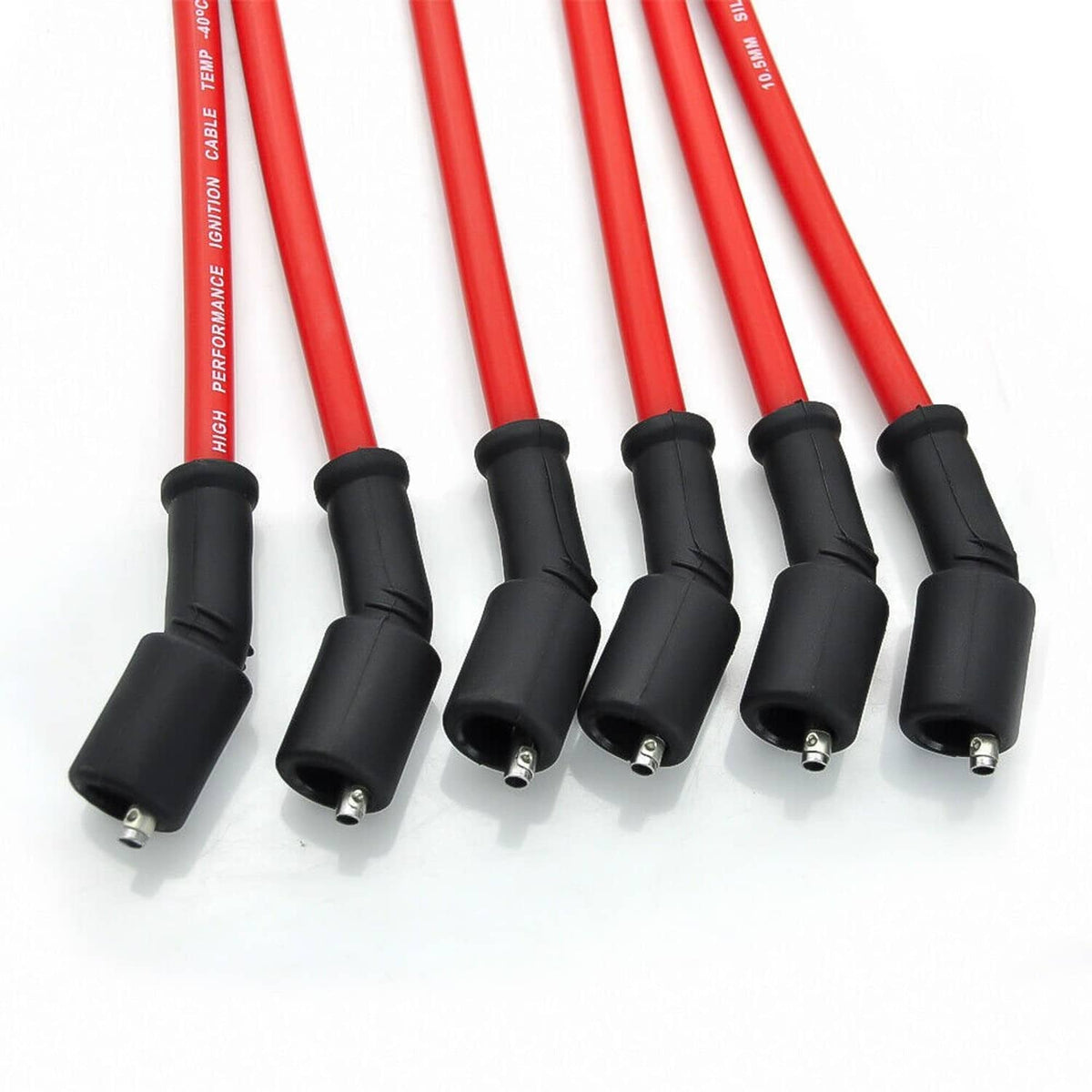 Ignition wire ends with black boots and metal terminals on red cables