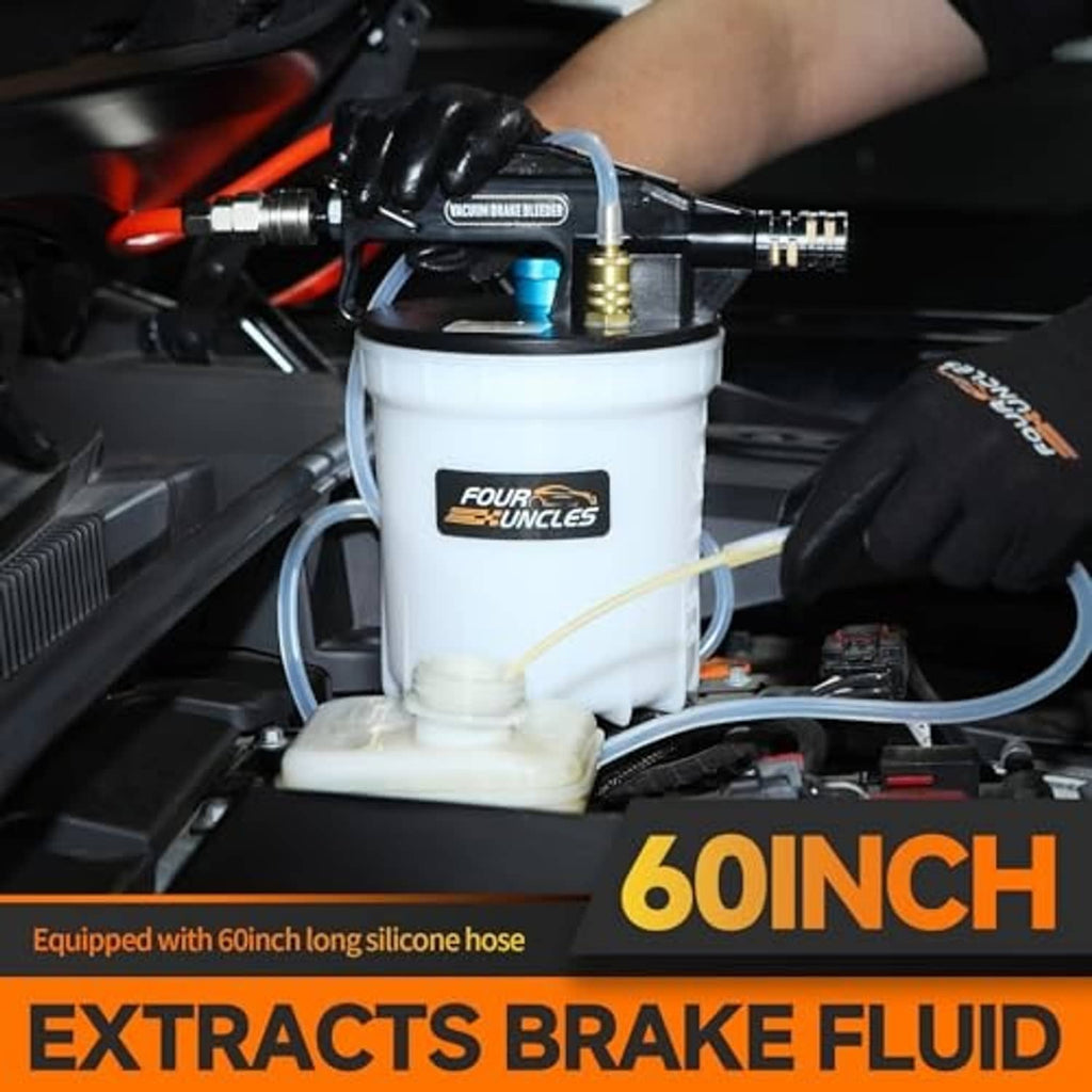 Vacuum brake fluid extractor setup connected in engine bay, white reservoir with hoses