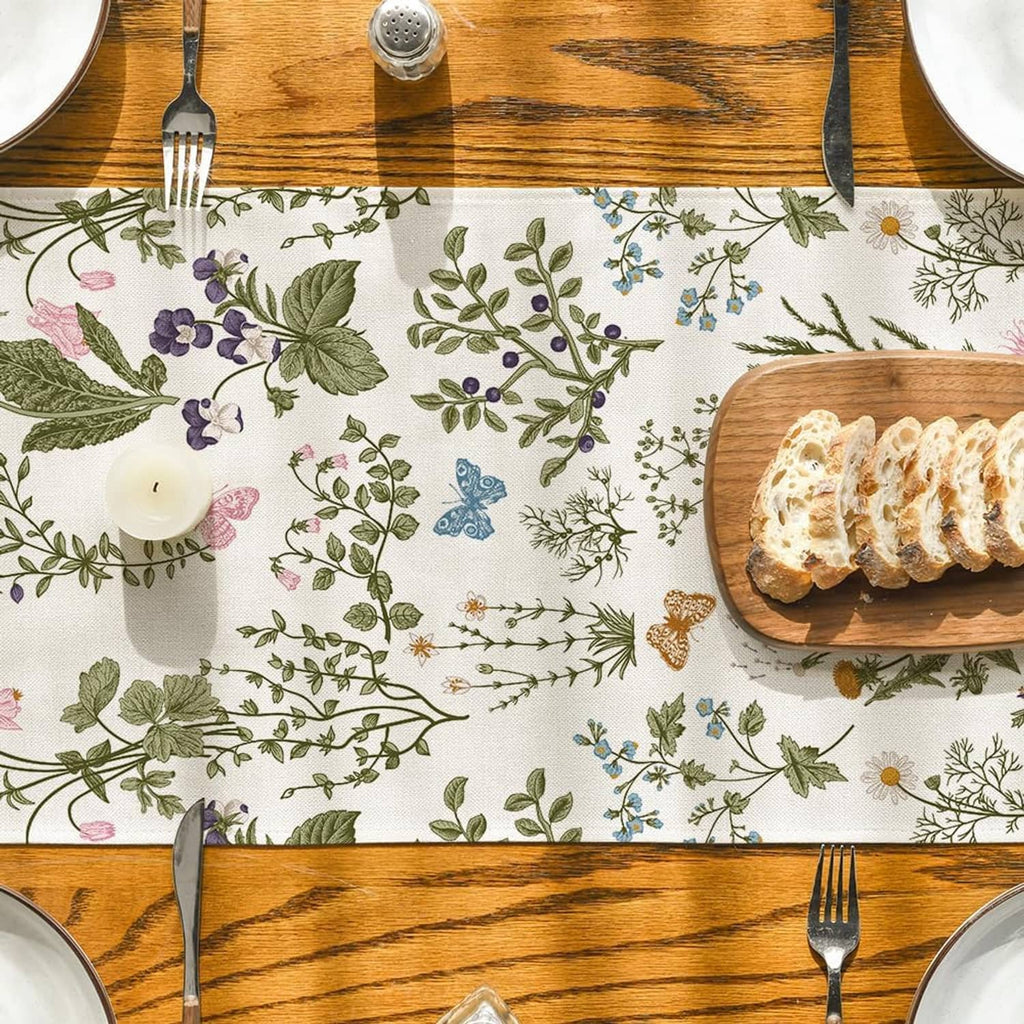 Wildflower table runner with butterfly print, placed between serving plates