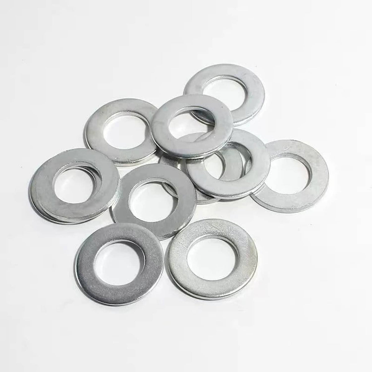 Loose set of silver crush washers, round rings with central holes