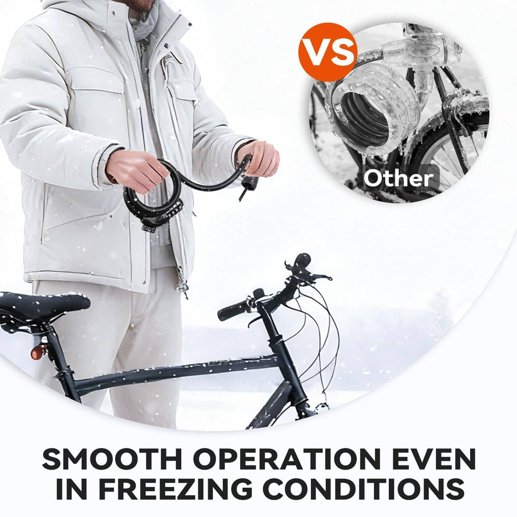 Black cable lock held in hand with coiled loop beside a bicycle
