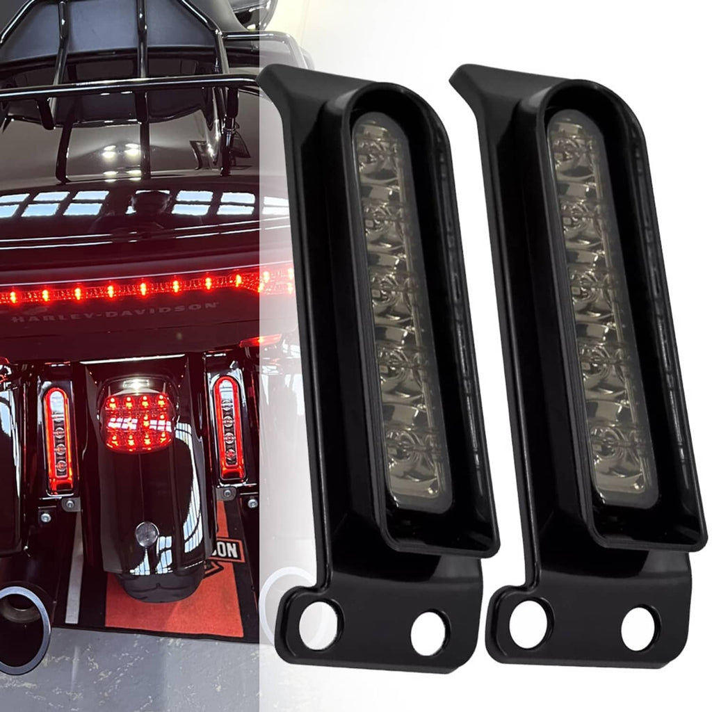 Saddlebag LED filler lights mounted on motorcycle, black housings with clear lens panels