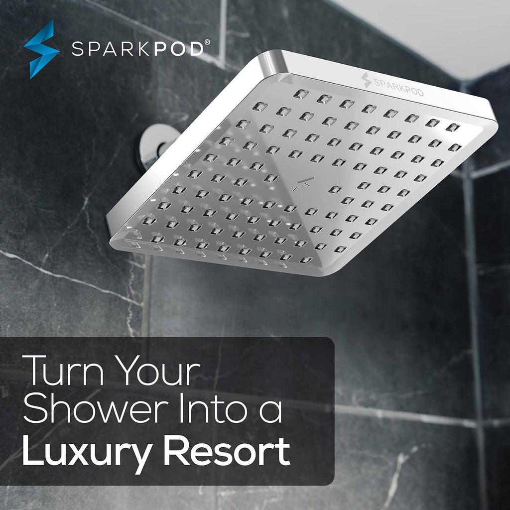 Square polished chrome rain shower head with fixed face and multiple spray nozzles