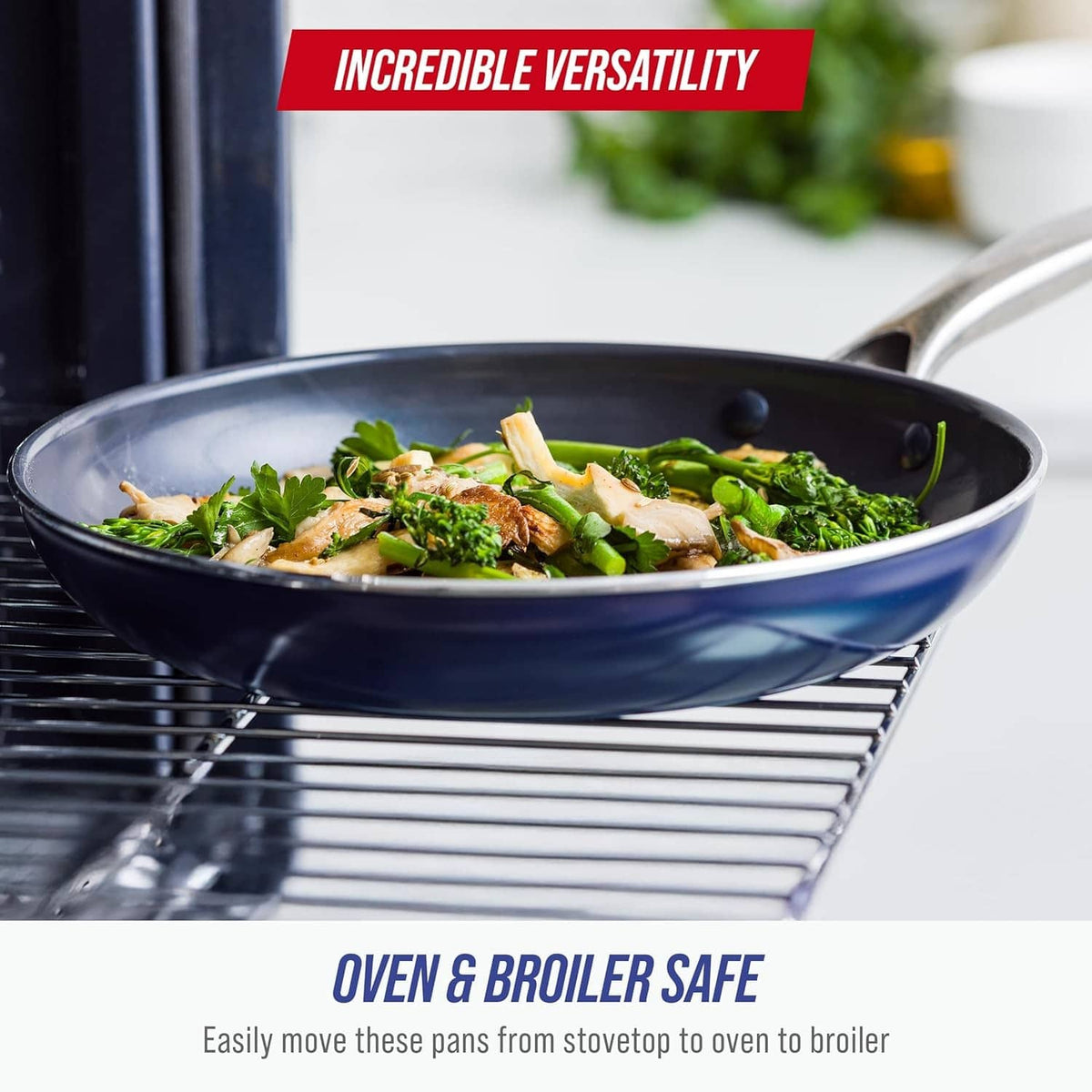 Blue ceramic nonstick frying pan filled with greens on a grill rack