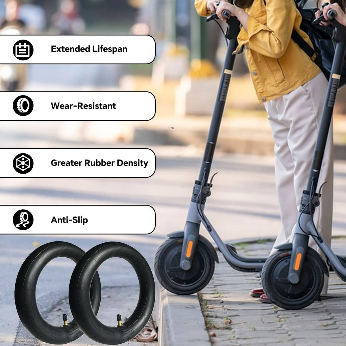 Two black scooter inner tubes for puncture protection, installed on a kick scooter