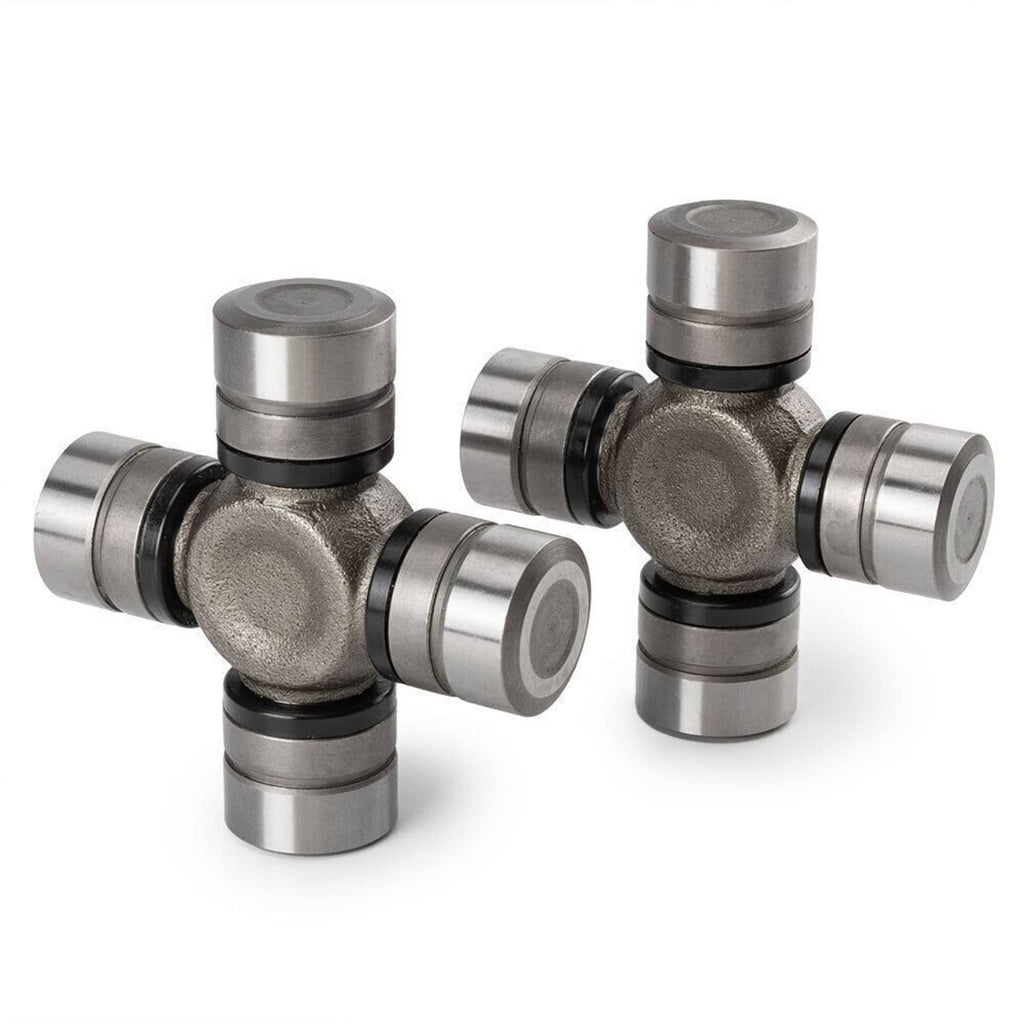 Greaseable front axle U-joint assemblies with metal cross and bearing caps