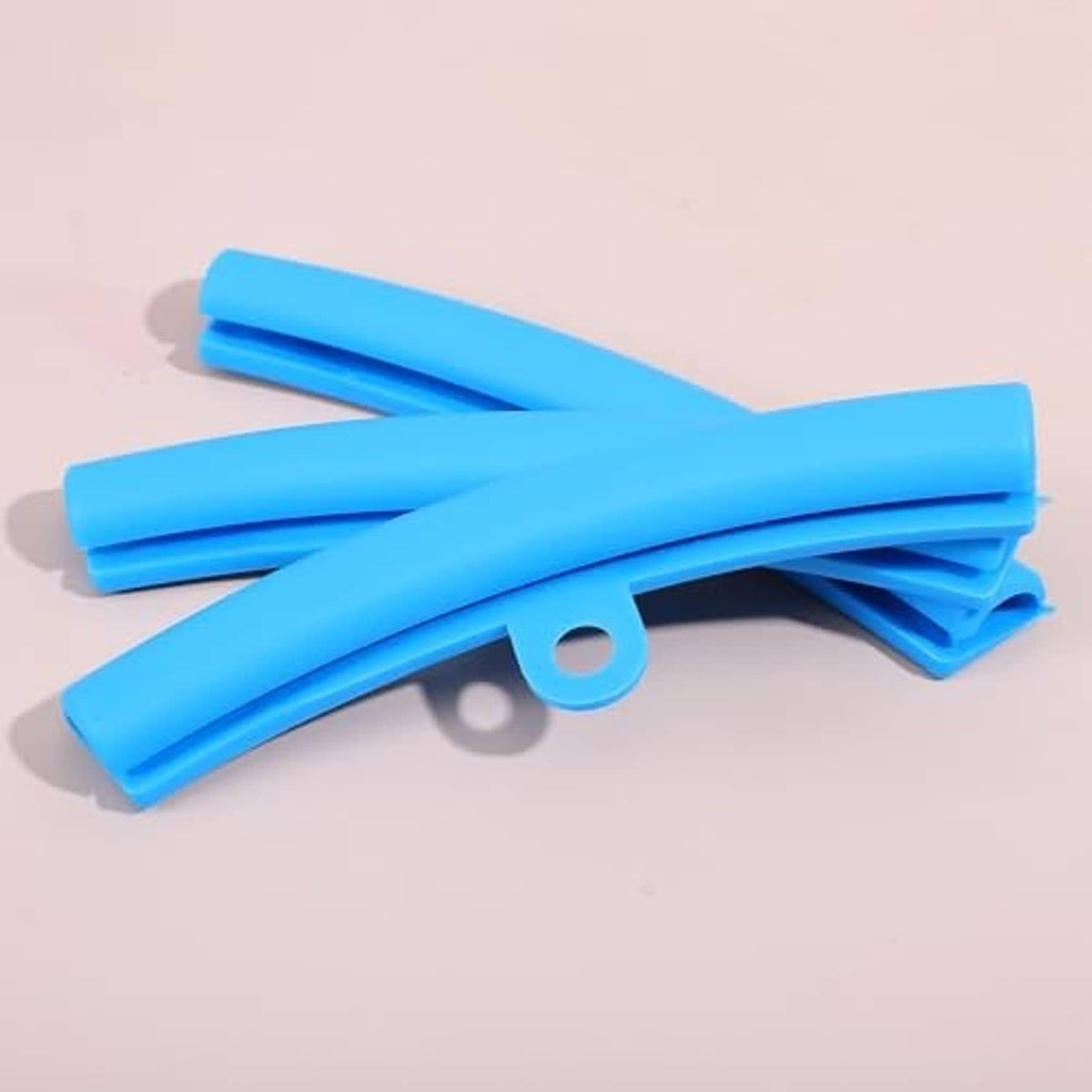 Blue rim protector sleeves with circular hole tabs and white tie cords