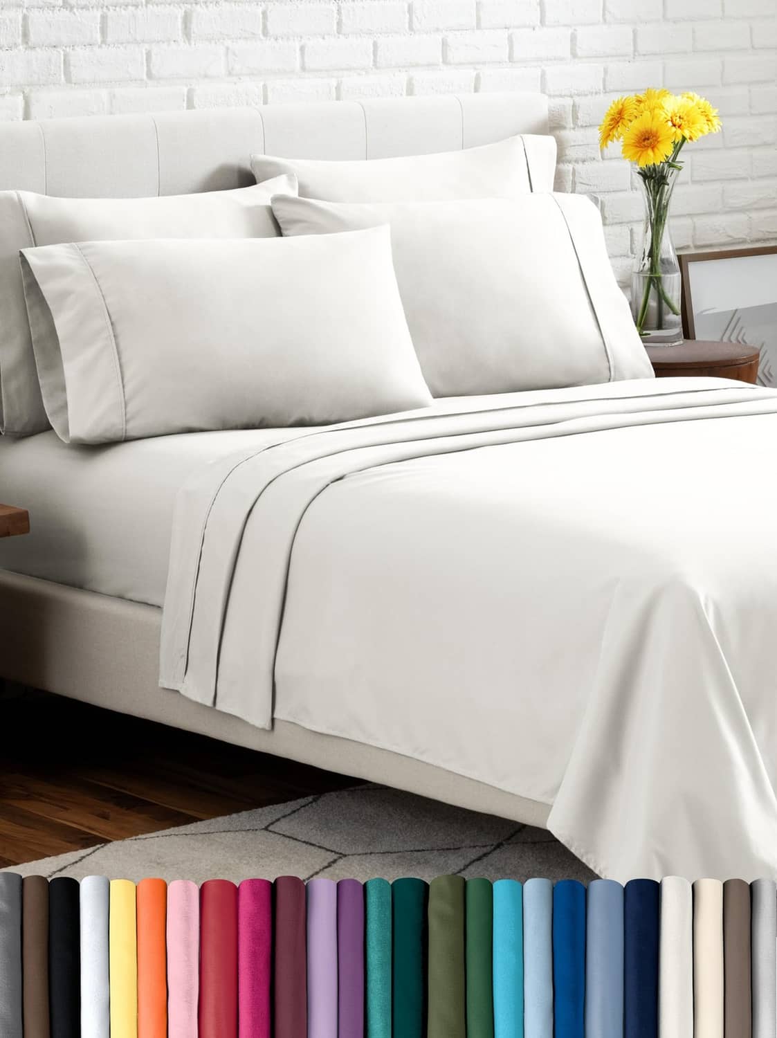 Cream microfiber bed linen set with flat sheet, fitted sheet, and pillowcases on bed