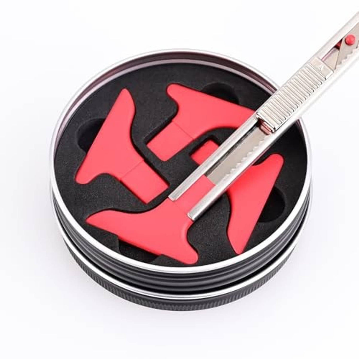 Vinyl wrap knife tucker tool with red/black insert and silver handle in round storage case