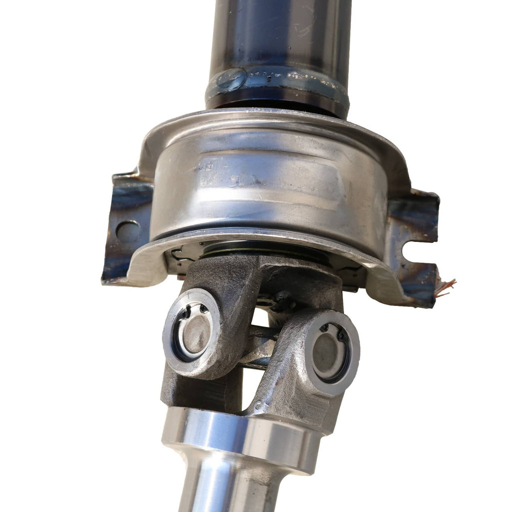 Rear drive shaft assembly close-up of suspension-style bracket and joint mount