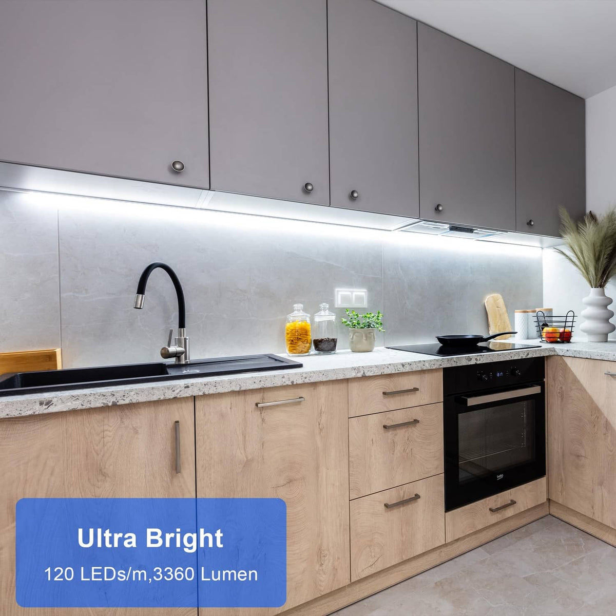 Under-cabinet LED strip light installed along the cabinet underside in cool white