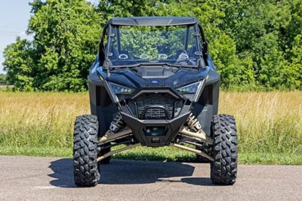 Side-by-side UTV with full windshield featuring clear panel and black frame