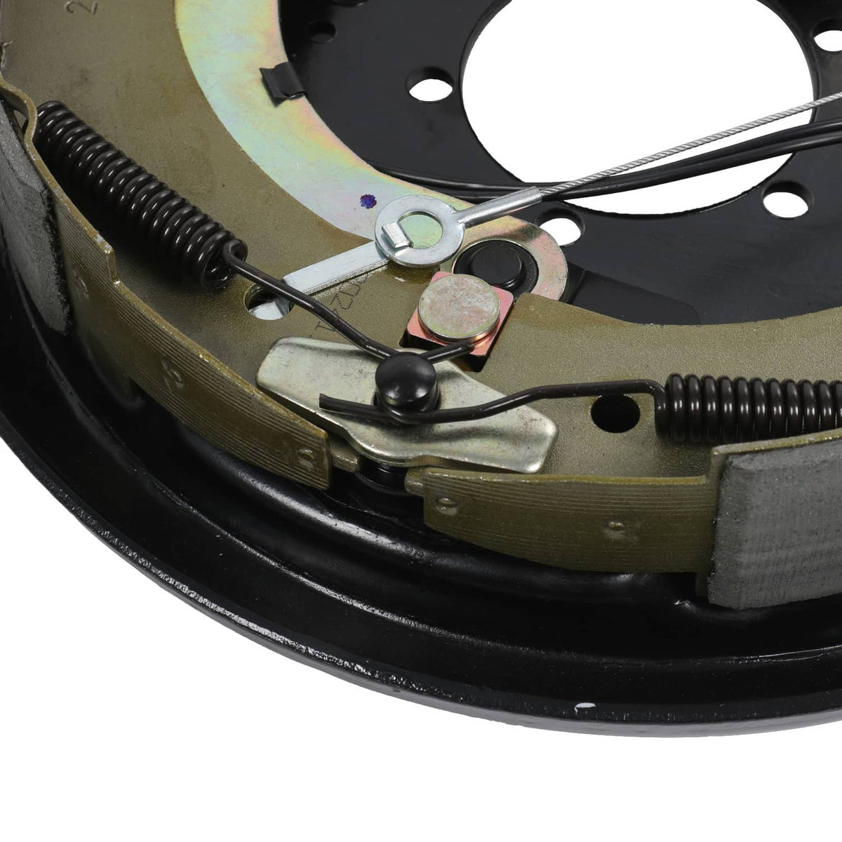 Close-up of brake lever linkage and return spring on electric trailer brake assembly