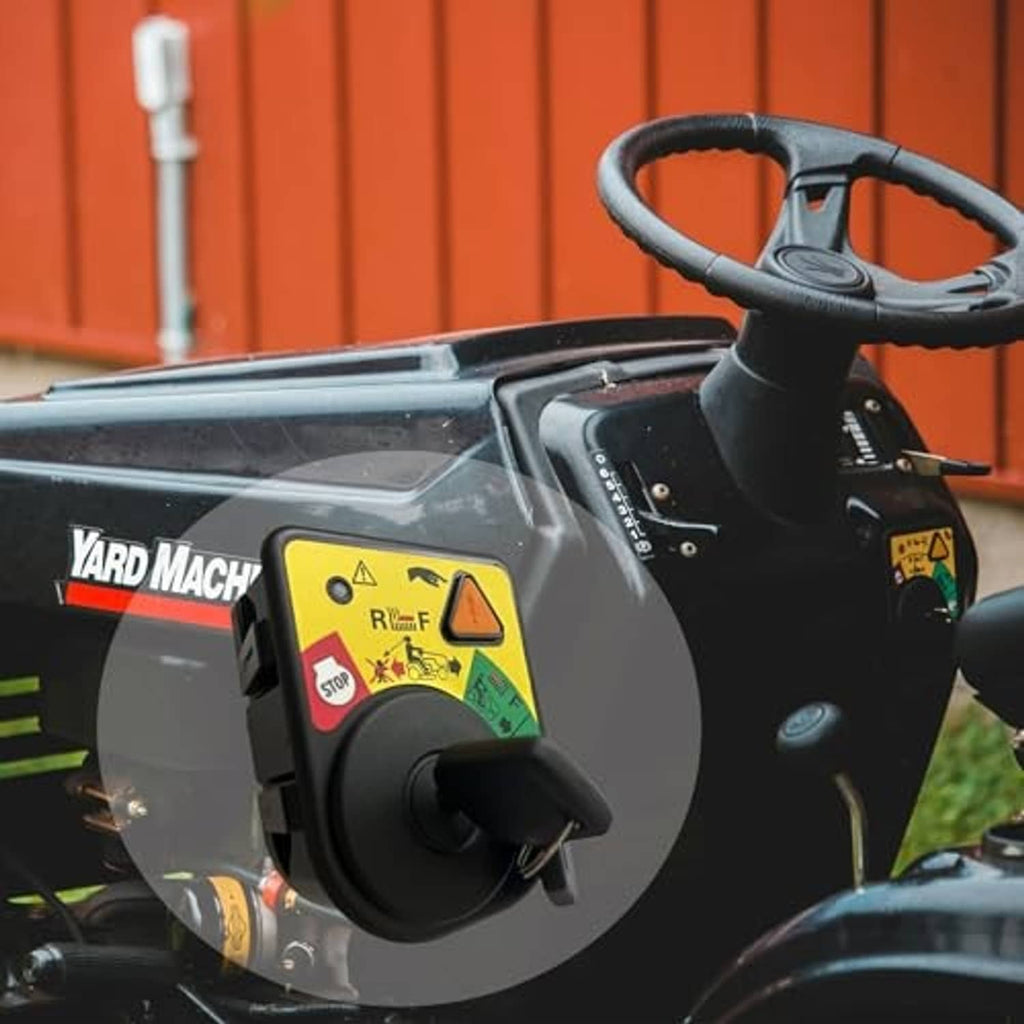 Ignition switch module mounted on lawn equipment control panel with key cylinder