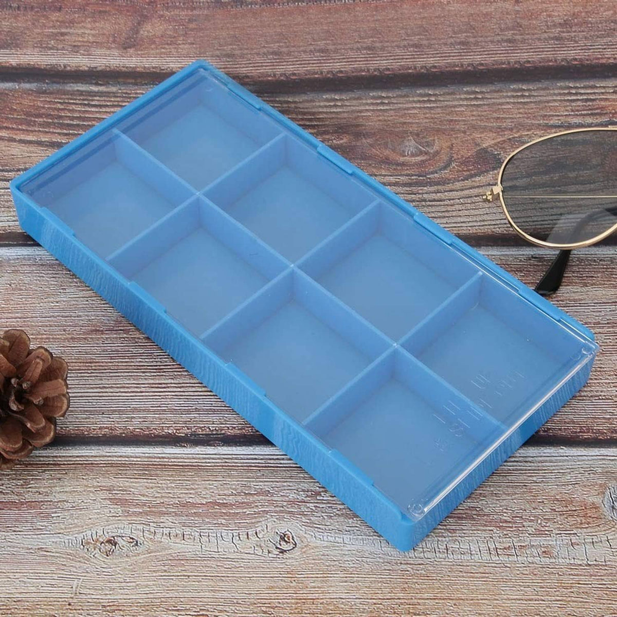 Blue plastic watch parts organizer tray with divided square compartments