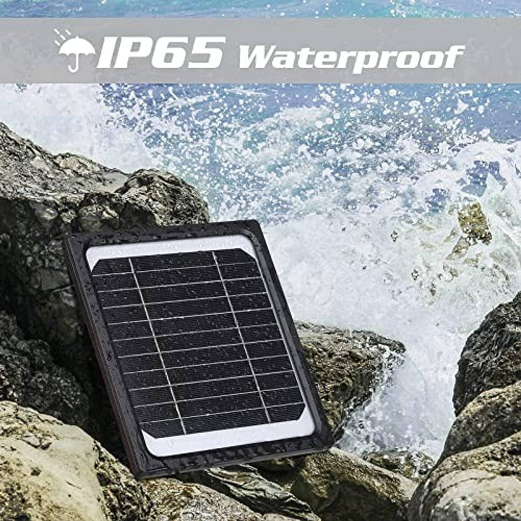 Black solar panel charger on rocks with water-splash splash-resistant housing