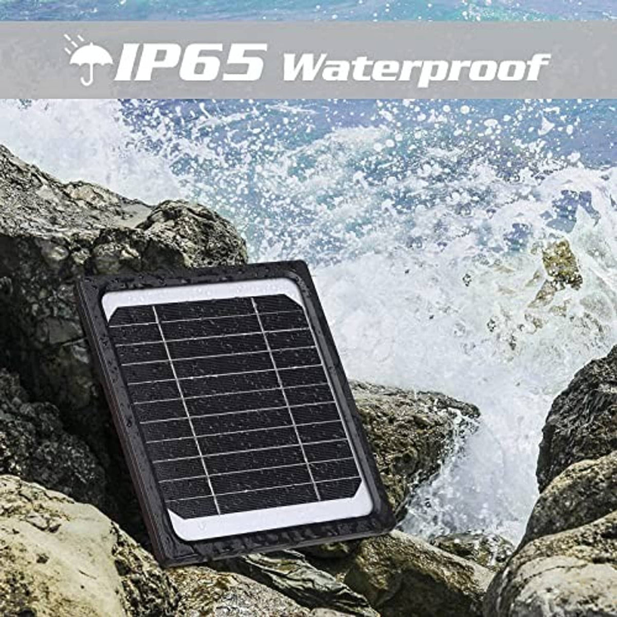 Black solar panel charger on rocks with water-splash splash-resistant housing